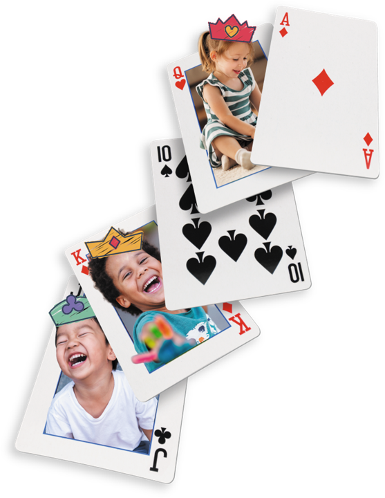 Playing cards featuring smiling children wearing crowns